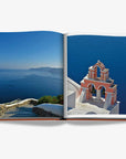 Stunning views of iconic Greek architecture and deep blue sea, from Assouline Greek Islands Luxury Travel Coffee Table Book at Spacio India.