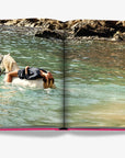 Serene image of woman relaxing on horseback in clear Mediterranean waters from Assouline's Ibiza Bohemia Luxury Coffee Table Book at Spacio India.