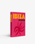 Vibrant pink and orange cover of Assouline’s Ibiza Bohemia luxury travel coffee table book, available at Spacio India.