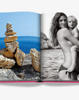 Assouline’s Ibiza Bohemia luxury coffee table book open to pages showcasing serene seaside stacked stones and striking monochrome portrait, found at Spacio India.