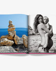 Assouline’s Ibiza Bohemia luxury coffee table book open to pages showcasing serene seaside stacked stones and striking monochrome portrait, found at Spacio India.