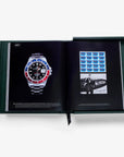 Assouline Impossible Rolex Coffee Table Book open on iconic Rolex watch page and aviation memorabilia, luxury decor available at Spacio India.