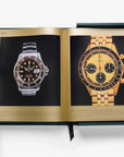 White-gloved hand showcasing rare vintage Rolex watches from Assouline Impossible Rolex luxury coffee table book, available at Spacio India.
