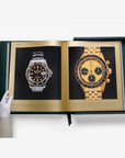 White-gloved hand showcasing rare vintage Rolex watches from Assouline Impossible Rolex luxury coffee table book, available at Spacio India.