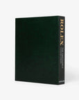 Side profile of the luxury Assouline Impossible Rolex Coffee Table Book showcasing elegant green cover, available at Spacio India stores.