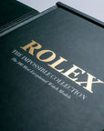 Elegant gold lettering on the green leather-bound Assouline Impossible Rolex coffee table book, luxury decor available at Spacio India.