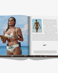 Open book showing a woman in a bikini on a beach with text and a 007 logo.