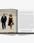 Open book showing a couple walking on a beach with text on the right page.