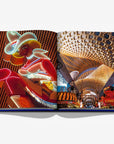 Open spread from Las Vegas Magic by Assouline, featuring iconic neon signs and the dazzling casino atmosphere, available at Spacio India.