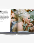 Inside spread from Las Vegas Magic by Assouline, featuring a vintage showgirl applying lipstick, capturing the city's timeless allure, at Spacio India.
