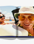 A classic cinematic image of two men cruising in a convertible in the desert, representing the spirit of Las Vegas from Assouline’s Las Vegas Magic, at Spacio India.