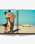 A timeless scene from Las Vegas Magic by Assouline, featuring a glamorous couple against a desert backdrop, available at Spacio India.