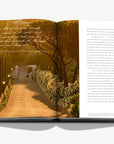 An entryway double spread picture in the luxurious Assouline Wine & Travel France coffee table book featuring France’s finest vineyards and wine regions, available at Spacio India retail stores and online.