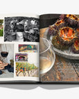 A colourful double spread pictures of fruits and wine in the luxurious Assouline Wine & Travel France coffee table book featuring France’s finest vineyards and wine regions, available at Spacio India retail stores and online.
