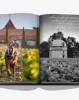 A double spread of a horse carriage and castle in a luxurious Assouline Wine & Travel France coffee table book featuring France’s finest vineyards and wine regions, available at Spacio India retail stores and online.