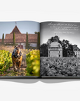 A double spread of a horse carriage and castle in a luxurious Assouline Wine & Travel France coffee table book featuring France’s finest vineyards and wine regions, available at Spacio India retail stores and online.