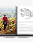 Burgundy map on a double spread in a luxurious Assouline Wine & Travel France coffee table book featuring France’s finest vineyards and wine regions, available at Spacio India retail stores and online.