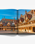 A colourful double spread in a luxurious Assouline Wine & Travel France coffee table book featuring France’s finest vineyards and wine regions, available at Spacio India retail stores and online.