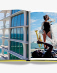 Modern luxury beachfront apartment with sleek glass balconies overlooking the ocean, capturing the architectural elegance of Miami. Available in the Assouline Coffee Table Book Miami Beach at Spacio India.