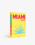 Top cover page of a luxurious Miami Beach coffee table book by Assouline, featuring vibrant photography and elegant design, available at Spacio India for collectors and decor enthusiasts.