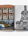 A double spread of a juxtaposition of urban sculptures featuring six stone reliefs on a brick wall with passing vehicles and a grand, black-and-white equestrian statue in a luxurious Assouline Milan Chic coffee table book, showcasing Milan’s timeless elegance, now available at Spacio India’s online store and retail outlets.