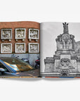 A double spread of a juxtaposition of urban sculptures featuring six stone reliefs on a brick wall with passing vehicles and a grand, black-and-white equestrian statue in a luxurious Assouline Milan Chic coffee table book, showcasing Milan’s timeless elegance, now available at Spacio India’s online store and retail outlets.