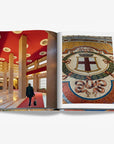 A double spread of a milan’s architectural elegance, featuring a grand interior with red ceiling and a historic mosaic in a luxurious Assouline Milan Chic coffee table book, showcasing Milan’s timeless elegance, now available at Spacio India’s online store and retail outlets.