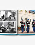 A double spread blend of historical and modern Monaco. The left page features vintage black-and-white photographs of Princess Grace, capturing her elegant life. The right page presents a vibrant image of the Palace Guards performing a ceremonial drill at the Prince's Palace of Monaco in a luxurious Assouline's Monte Carlo coffee table book, featuring a vibrant cover with images of Monaco's iconic landmarks, available at Spacio India.
