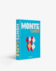 Top cover page of a luxurious Assouline's Monte Carlo coffee table book, featuring a vibrant cover with images of Monaco's iconic landmarks, available at Spacio India.