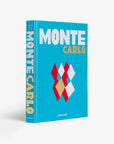 Top cover page of a luxurious Assouline's Monte Carlo coffee table book, featuring a vibrant cover with images of Monaco's iconic landmarks, available at Spacio India.