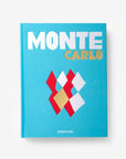 Front cover page of a luxurious hardbound Assouline's Monte Carlo coffee table book, featuring a vibrant cover with images of Monaco's iconic landmarks, available at Spacio India.