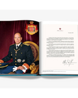 An elegant royal portrait with a letter beside him on a double spread of a luxurious hardbound Assouline's Monte Carlo coffee table book, featuring a vibrant cover with images of Monaco's iconic landmarks, available at Spacio India.