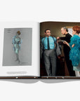 Open book showing a fashion design sketch and a photo of a man and woman in formal attire.