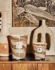 Baobab Sand Siloli Candle - Elegant home decor candle with desert-toned glass and a warm fragrance, featuring cedarwood and tonka bean, available at Spacio India.