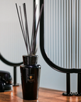 Baobab Encre De Chine Diffuser 500ml, a premium scent diffuser with smoky leather and amber aroma, placed on a modern console table, available at Spacio India.