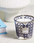 Baobab My First Baobab Manhattan candle from Gift Set beside book & vase in modern interior available at Spacio India for luxury home decor collection of Gift Sets of Candles & Fragrance.