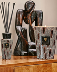 Baobab Panya 500ml Diffuser and scented candle set, styled in an elegant interior. The hand-blown glass diffuser enhances luxury home decor. Available at Spacio India.