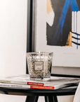 Baobab My First Baobab Platinum candle from Gift Set on a coffee table with books in an interior available at Spacio India for luxury home decor collection of Gift Sets of Candles & Fragrance.