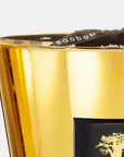 Close-up of Baobab Aurum Candle Max 10 gold detailing and branded ribbon, available at Spacio India