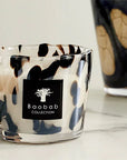 Close-up of Baobab Black Pearls Candle Max 10 showcasing artistic glass detailing on marble surface. Purchase online or at Spacio India stores.