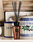 Baobab Cyprium Diffuser 500ml placed elegantly among Mediterranean-style ceramic jars, exuding its sophisticated aroma of sandalwood, iris, and papyrus; available online and in-store at Spacio India.