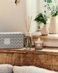 Baobab Gentlemen My First Baobab Gift Set with candle and diffuser placed on wooden ledge, available at Spacio India. Features a masculine scent with rum, saffron, and labdanum.