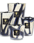 Four Baobab Stones Lazuli Candles with signature blue marble glass and elegant branding. Luxury fragrance blend of musk and sea salt, exclusively at Spacio India.
