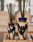 Elegantly styled Baobab Stones Lazuli Mini Totem Diffusers displayed on a rustic wood table, sophisticated home fragrance from Baobab Collection at Spacio India.