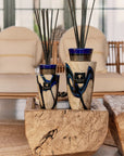 Lifestyle image of Baobab Stones Lazuli Diffuser Totem in beautifully styled living room, emphasizing its artisanal blue and gold glass craftsmanship, available at Spacio India online and stores.