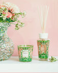 Baobab Collection Tomorrowland candle and diffuser on display near fresh flowers, part of luxury home decor available at Spacio India