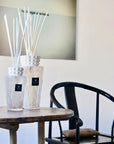 Minimalist-styled interior featuring Baobab White Pearl Diffuser duo emitting soft musk and freesia fragrance, a sophisticated glass decor item at Spacio India.
