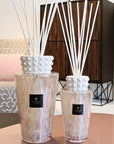 Pair of Baobab White Pearl Diffusers styled in a luxurious living room, exuding feminine elegance with white musk and freesia fragrance, available at Spacio India retail and online.