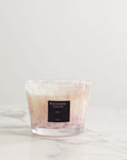 Baobab White Pearls Candle Max 10 placed on marble tabletop, featuring hand-blown glass and signature scent of white musk and freesia at Spacio India.