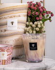 Baobab Collection candle trio including White Pearls Max 16, styled with flowers for sophisticated interiors, exclusively at Spacio India.